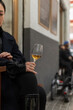 © Milles Team/Stocksy - Woman tasting white wine at street cafe