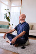 © Jovo Jovanovic/Stocksy - Retired man listening to meditation app