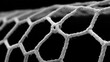 © paisorn - Close-Up of White Mesh Netting on a Black Background
