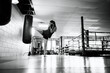 © Rob and Julia Campbell/Stocksy - Woman Practicing Kickboxing Kicks in Gym with Punching Bag