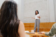© Daniel Zapata/Stocksy - Group of young business people having a meeting.