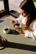 © Adrian Rodd/Stocksy - Healthy woman enjoying an organic breakfast in a rural home