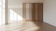 © Bintang - Empty, bright room with light-wood partition. Sunlight streams in