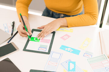 Wall Mural - asian woman ui ux designer creating website interface design for mobile app on tablet. user experien