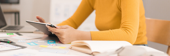 Canvas Print - ui ux designer asian woman hands using tablet for mobile app website design process user interface p