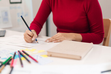 Canvas Print - ui ux designer asian woman designing mobile app interface website wireframe sketching user experienc