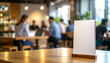 © MUHAMMADFATUR - Standing Tabletop Menu Mockup with Blurred Background of Customers in Café or Restaurant
