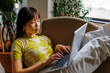 © BONNINSTUDIO/Stocksy - Woman studying remotely from home using laptop