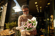 © Ivan Jovanovic/Stocksy - Man bought a bouquet of flowers