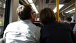 © drimerz - Back View of Two People Traveling on Public Transport, Looking Out Window on an Urban Journey