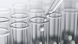 © Bintang - Clear test tubes with a dropper adding a liquid droplet