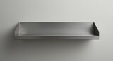 Empty brushed metal shelf at the wall
