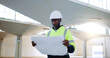 © peopleimages.com - Construction, blueprint and black man in building thinking for inspection, project ideas and planning. Engineering, industrial site and person with documents for floorplan, infrastructure and layout