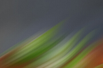 Wall Mural - abstract diagonal streaks of green, orange, and gray create a blurred and textured background with a