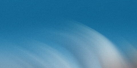 Wall Mural - a blurred abstract background with a gradient of blue and white creates a textured and grainy visual