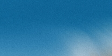Wall Mural - a blurred abstract background with a gradient of blue and white creates a textured and grainy visual