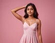 © Sagar - a teenage girl shows her armpit with smooth, clean skin isolated on a pink background.