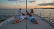 © max - Family Relaxing on a Sailboat Deck at Sunset