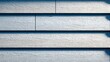 © diaspradina - Close-Up of White Wood Siding Creating a Textured Geometric Pattern