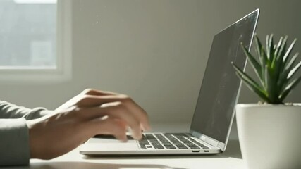 Typing hands on laptop keyboard working from home office desk, business concept