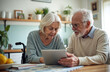 © Pete - Senior couple looks tablet pc display in kitchen. Elderly woman in wheelchair and her husband online. Happy old people talk using digital tech at home. Remote communication and healthcare.