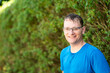 © Werner - Portrait of a 46 yo man with glasses against a green background in Ternat, Flemish Brabant, Belgium