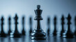 © BizPics - A single black chess king stands out among blurred pieces, suggesting strategy, leadership, and a commanding presence on the game board.