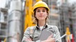 © standret - Confident female engineer standing at a construction site with a clipboard