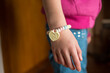 © Austockphoto - Young girl wearing candy bracelet hand only