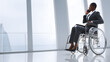 © Jan - African American Businesswoman in Wheelchair on Phone in Modern Office: Diverse and Inclusive Workplace