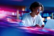 © The Little Hut - Young woman working on a laptop in a modern office environment with vibrant neon lights and blurred motion effects for technology and innovation themes