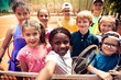 © Marko Geber - Diverse group of kids taking a selfie at tennis summer camp on clay court