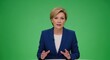 © Dmitry - Woman presenter reporting news on green screen background. Media professional broadcasting on television. Studio production for chroma key presentation.