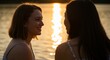 © Arx PhotoStock - Two woman conversation at sunset on lake