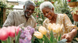 © Narmin - Elderly African couple enjoys gardening together in their backyard, combining leisure with shared passion for flowers.