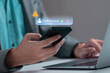 © Montri - Phone call from unknown number late at night. Scam, fraud or phishing with smartphone concept. Prank caller, scammer or stranger. Man answering to incoming call. Hoax person with fake identity.