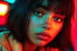 © Sergey - Portrait of a young woman with vibrant, colorful lighting, accentuating her features and short dark hair. Intense and captivating gaze.
