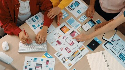 Wall Mural - top view panorama video of startup company employee planning on user interface prototype for mobile 