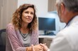 © aryuna99 - A middle-aged woman sits attentively listening to a doctor in a consultation room, hands clasped in her lap,  exuding a pensive expression