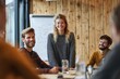 © aryuna99 - A smiling young woman stands at a conference table, presenting to a small group of colleagues in a rustic, wood-paneled room.  They are seated around the table, engaged in conversation