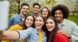 © Abeto_21 - Group of Friends Taking Selfie Together Outdoors with Blooming Trees