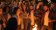 © Reza - Nighttime Bonfire Party Friends, Laughter, and Good Times