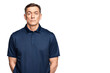 © The Stock Guy - Serious mature man in a navy polo shirt standing with arms behind his back. Stern facial expression, isolated on transparent background