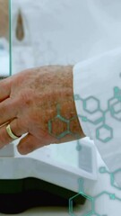 Wall Mural - animation of scientific data processing over caucasian male scientist in laboratory
