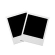 © Suryani - Two blank instant photo frames with classic white borders, overlapping slightly, ready for your cherished memories or creative designs.