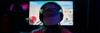 © pressmaster - Teenage girl wearing headphones sitting in front of large gaming monitor playing video game in dark room, back view showing focused posture, participating in girls gamers team event