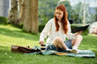 © Bliss - Relaxing in the park with a book and coffee on a sunny afternoon