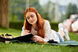 © Bliss - Relaxing afternoon with a notebook in a serene outdoor setting under a tree