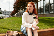 © Bliss - Relaxing on a sunny afternoon with coffee and music in a vibrant urban setting