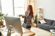 © Bliss - Engaging young woman enjoys her spare time in a cozy, sunlit living space while multitasking